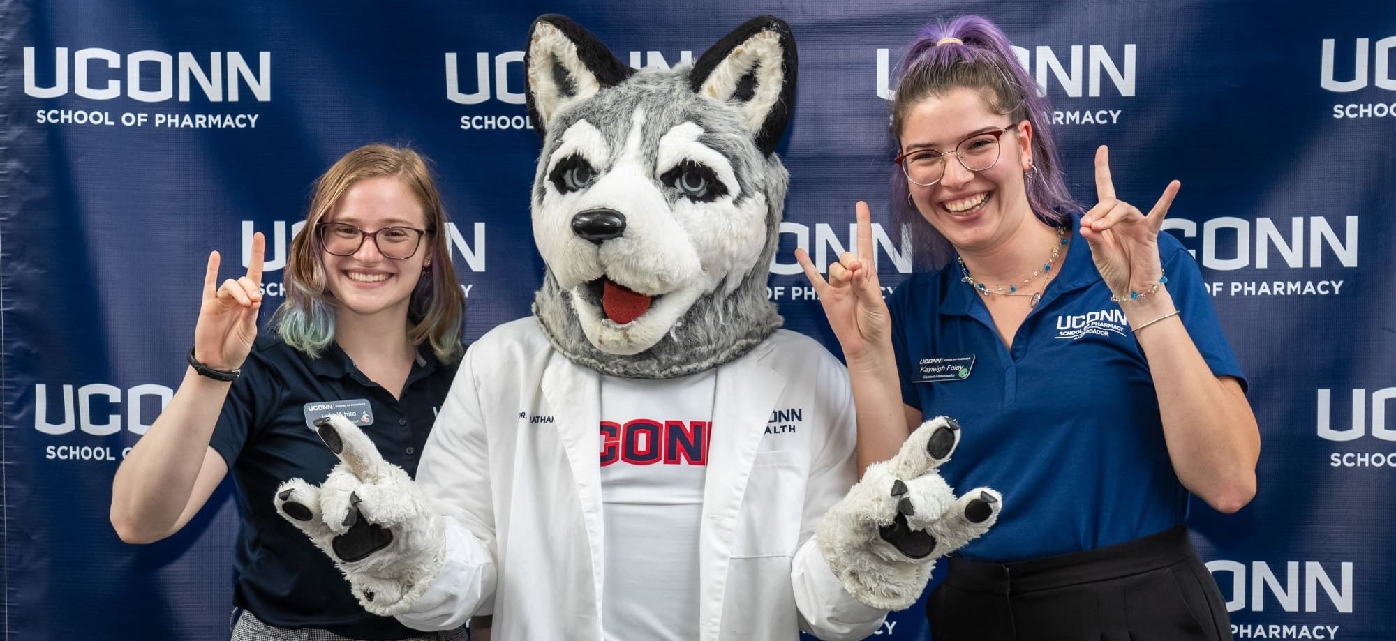 UConn students and Jonathan the Husky.